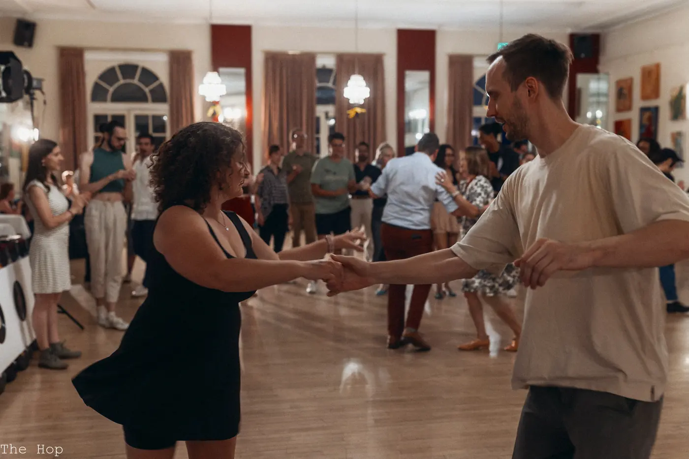 Couples dancing across the Turnverein floor